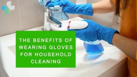 cleaning the bathroom sink wearing blue disposable gloves on