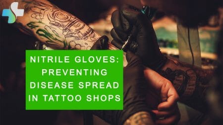 Tattoo artist wearing nitrile gloves to safeguard against disease spread in tattoo shop, nitrile gloves for tattooing, preventing disease spread with nitrile gloves