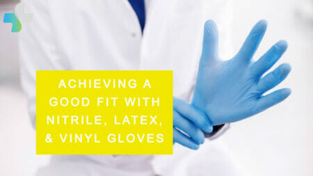 Doctor putting on a pair of nitrile, vinyl, or latex gloves
